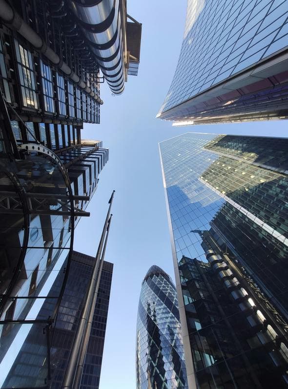 Looking upward between Lloyd's and neighbouring City buildings